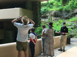 Fallingwater educator in mask with group tour