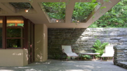 Photo of outdoor lounge chairs at the Fallingwater guest house