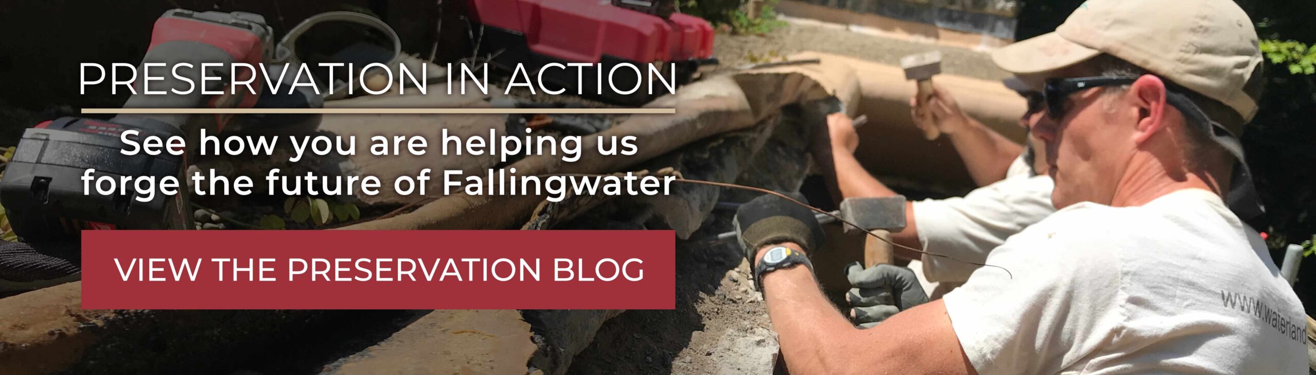 Workers chisel away deteriorated concrete along the edge of the flat roof of the Fallingwater house on a sunny day.