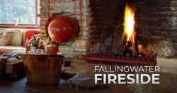 A fire roars in the Fallingwater living room fireplace.