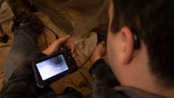 A borescope captures both photos and video of the empty spaces within the wall.