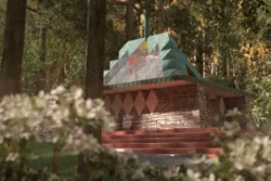 A computer rendering of a modern chapel in the forests. Out of focus rhododendrons bloom in the left foreground. The chape sits between multiple large deciduous trees and is made with walls of stacked stone and concrete casts in a diamond geometric pattern and covered in stucco. The roof is steeply pitched and constructed of glass and copper that has turned a patina green.
