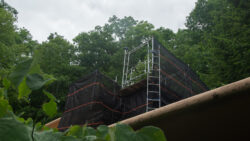 The scaffolding provides the masons with safe access to all levels of the stone walls at the Guest House.