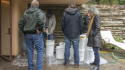 Pamela Jerome, preservation architect. Pamela is shown here onsite with the Masonry Solutions International team during a grout injection test at the Guest House in 2023.