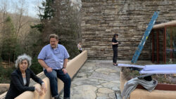 Pamela, Stephanie Gerard and Douglas Emilio of Architectural Preservation Studio conducts a preliminary assessment of the third-floor terrace, roof and central chimney tower in 2019.