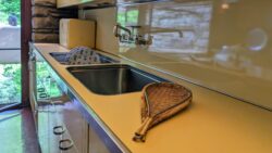 Fruit strainer and basket (1947-1950) designed by Carl Auböck II (1900-1957), on display in the kitchen