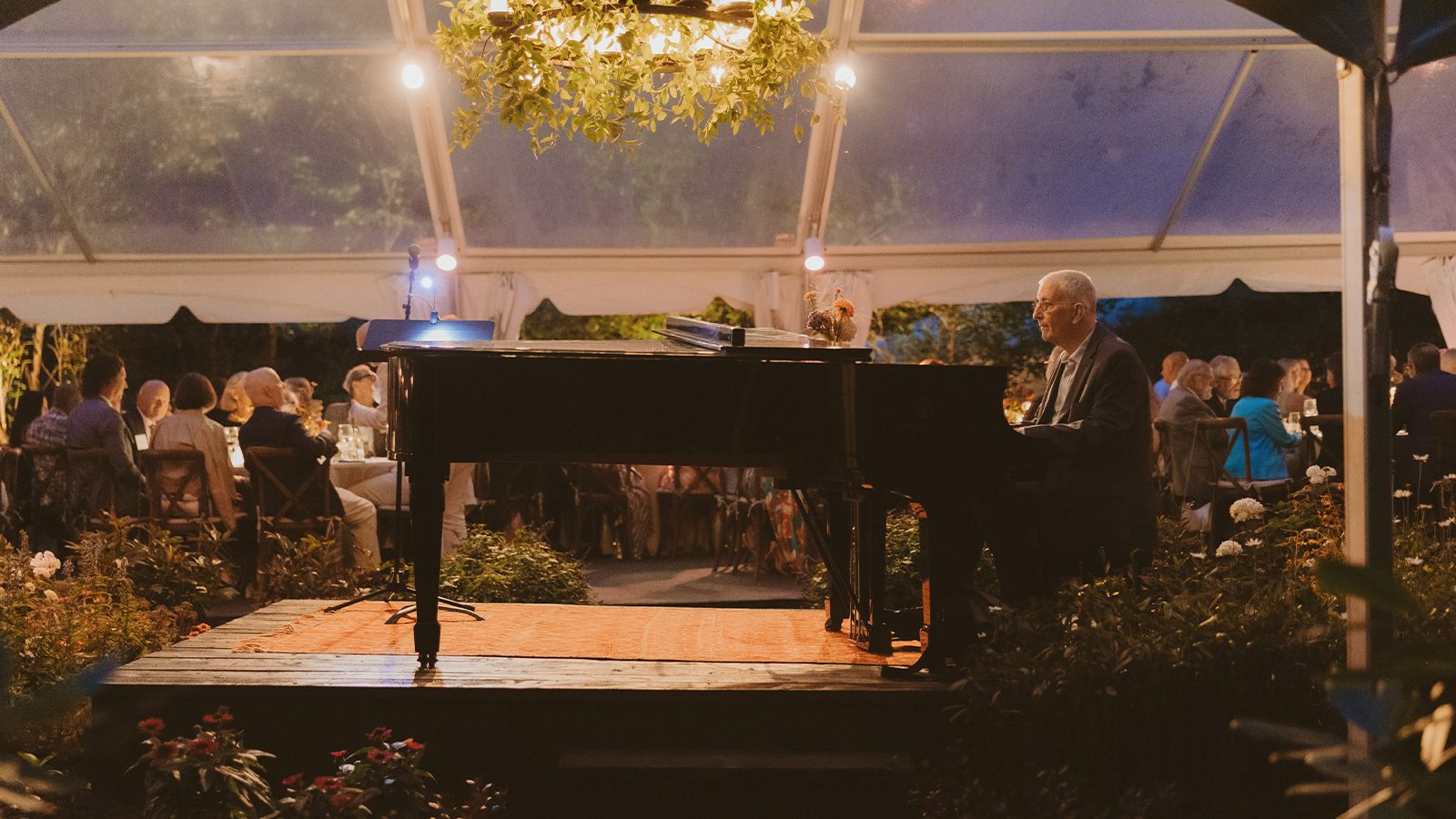piano player at gala playing piano
